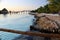 View of a wooden bridge crossing over the blue water connecting the tropical coasts