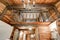 View of wooden ceiling with chandelier from the Bathroom