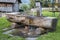 View of a wooden drinking water trough in Fie allo Sciliar, South Tyrol, Italy on