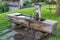 View of a wooden drinking water trough in Fie allo Sciliar, South Tyrol, Italy on