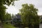 View of wooden houses, canal and trees in Zaanse Schans