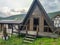 View of the wooden houses for the rest of tourists in the Caucasus mountains. Prielbrusye National Park, Kabardino-Balkaria,