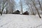 View of the wooden hunting lock in the Central park after the first snow