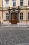 View of a wooden ornamented door in a street in Prague