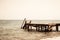 View of a wooden pier and seascape with running waves