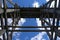 A view of a wooden railway trestle bridge from underneath perspective