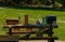 View of the wooden table with baskets of food prepared for the outdoor summer picnic in a park. Harrison Lake, BC.