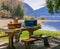 View of the wooden table with baskets of food prepared for the outdoor summer picnic in a park. Harrison Lake, BC