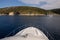 View from the yacht on the rocky coast of the KASTOS island, Lefkada Regional unit, Ionian Islands, Greece.