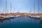 The view of yachts moored in harbor in Dockyard creek with Senglea peninsular on background. Malta