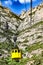 A view of the yellow cable cars climbing Santa Maria de Montserrat abbey in Monistrol, Catalonia, Spain