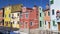 View on yellow, pink and blue houses on Burano island, architecture in Venice