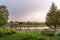 View of the Yenisei Bayou in Krasnoyarsk and the embankment, the design of the coastline. pine trees, greenery