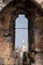 View of York Minster through the arrow slit at the top of historic Clifford`s Tower, England UK