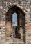 View of York Minster through the arrow slit at the top of historic Clifford`s Tower, England UK