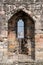 View of York Minster through the arrow slit at the top of historic Clifford`s Tower, England UK