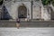 View of young couple climbing the stairs of Lamego Cathedral with labrador guide dog