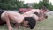 A view of young sportsmen doing push-ups on a training