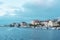 View of Zadar city embankment with residential buildings  palm trees and moored boats  Croatia