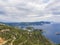 View at zigzag road, hills cllifs, forest and turquoise blue sea at Paleokastritsa bay from the view point at mediavel