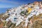 Viewing point of Santorini Caldera Oia white houses and windmills, Oia, Santorini Island, Greece