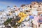 Viewing point of Santorini Caldera Oia white houses and windmills, Santorini Island, Greece