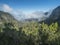 Viewpoint Mirador del El Rejo on road to Hermigua. Mossy tree valleyo, foggy green hill at mist laurisilva forest of the