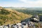 Viewpoint over a flat valley with rural villages surrounded by farmlands and arid hills