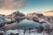 Viewpoint of Reine village with snow mountain range on coastline at Lofoten islands