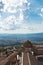 Viewpoint on a surrounding landscape from a bell tower over the roof and dome of Volterra cathedral, Tuscany