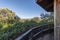 Viewpoint with wooden railing in a wooded area of the mountains