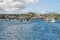 Views of boats and houses arriving at colorful Puerto Baquerizo Moreno