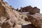 Views within the Charyn Canyon to the reddish sandstone cliffs