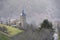 Views of the church of Mont in Vielha with snowy mountains in the background