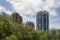 Views of circular high rise buildings against the clouds in the sky from below at Miami, Florida