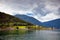 Views of the fjords, small village, forest and mountains in cloudy weather in Norway