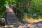 Views of Jordan River Trail Pedestrian and Train Track Bridge with surrounding trees, Russian Olive, cottonwood and muddy stream a