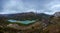 Views of lake and mountains with fog on the peaks. Panoramic photo of the reservoir and city of Guadalest, Alicante, Spain