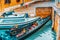 Views of the most beautiful channels of Venice, empty gondola near the Pier. Venice, Italy