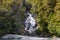 Views of New Zealand. Waterfall among the greenery. South Island