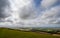 Views over the Weald with sunshine and clouds seen from the South Downs Way