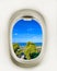 Views from the plane window on the coastal area of the hotel. Close-up of the porthole. Travel realistic background
