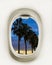 Views from the plane window on palm trees at sunset. Close-up of the porthole. Travel realistic background illustration. Airplane