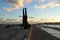 Views of the port of Fuengirola at sunset with the figure of a young man doing a handstand