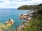 Views of the rocky coast of the azure sea.