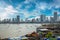 Views of slums on the shores of Mumbai, India against the backdrop of skyscrapers under construction