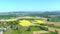 Views of Swiss rural area, green farmlands, forests and mountains in distance