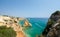 Views of yellow limestone cliffs and Atlantic ocean from the observation deck. District Faro, Algarve, Southern Portugal