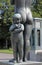 Vigeland park, Oslo, Norway, young girl standing with her mother.