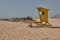 Vigilant in the yellow shed looking at the sea in the beach of Corralejo, Fuerteventura